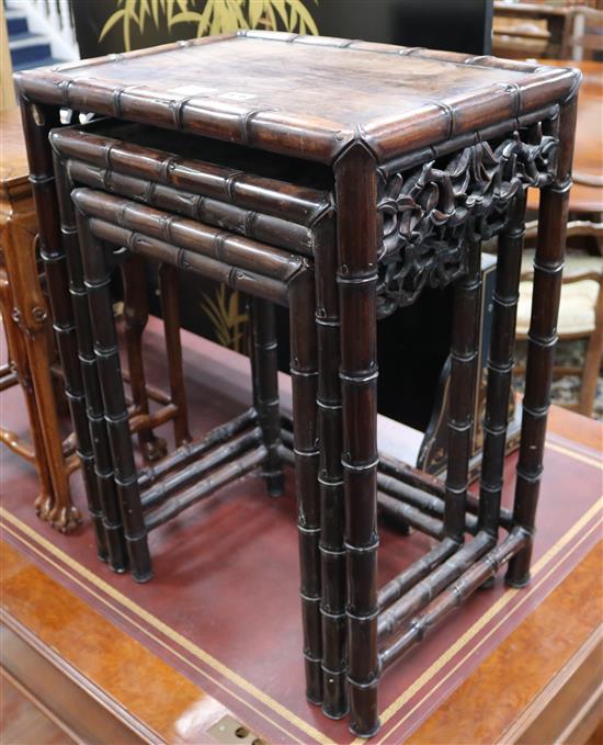 A nest of three Chinese hardwood tea tables W.48cm